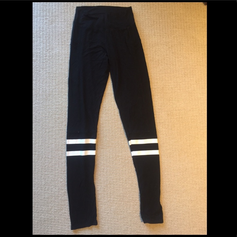 Black leggings with white racer stripes